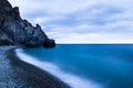 Beautiful sunset over wavy stormy Black sea rocky coastline in Crimea on summer day Royalty Free Stock Photo