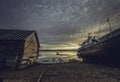 Beautiful sunset over White Sea with a ship and old house Royalty Free Stock Photo