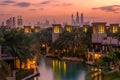 Beautiful sunset overlooking the canal, villas and skyscrapers of Dubai