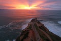 Beautiful sunset ower the Fort of Nazare with Lighthouse, Portugal.