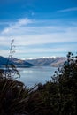 Beautiful sunset panorama at Hawea lake with snow capped mountains in the background on a winter day, New Zealand Royalty Free Stock Photo