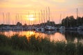 Beautiful sunset over yacht harbour on river near greifswald ger