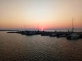 Beautiful sunset in Peraia, Thessaloniki Greece. Silhouettes walking on the promenade. Royalty Free Stock Photo