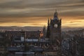 Beautiful sunset photo of Edinburgh city with clocktower and historical buildings