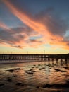 Beautiful sunset with the pier in the background in Cayucos. Royalty Free Stock Photo