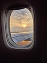 Beautiful sunset after rain view from inside window aircraft