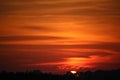 Beautiful sunset with red clouds on a calm evening. Royalty Free Stock Photo