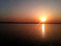 Beautiful sunset reflecting in the water of Morii Lake, Bucharest, Romania