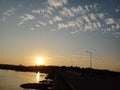 Beautiful sunset on the river blue sky clouds evening time water nature photography Royalty Free Stock Photo