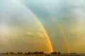 Amazing double rainbow over the river. Royalty Free Stock Photo