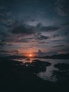 beautiful sunset with the river crisscrossed by coal boats