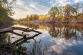 Beautiful sunset on the river in forest with sky reflection Royalty Free Stock Photo