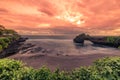 Beautiful Sunset at rocky coast Pura Batu Bolong, Tanah Lot temple, Bali, Indonesia. Royalty Free Stock Photo