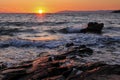 Beautiful sunset- rocky coast-waves