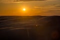 Beautiful sunset in sand dunes over barkhan desert in Kazakhstan Royalty Free Stock Photo