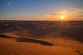 Beautiful sunset in sand dunes over barkhan desert in Kazakhstan Royalty Free Stock Photo