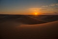 Beautiful sunset in sand dunes over barkhan desert in Kazakhstan Royalty Free Stock Photo
