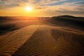 Beautiful sunset in sand dunes over desert Royalty Free Stock Photo