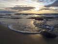 Beautiful sunset on the sandy beach of the Baltic Sea in Lietva, Klaipeda