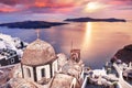 Beautiful sunset in Santorini island, Greece. Old church with sea view in Fira town