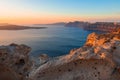 Beautiful sunset at Santorini island, Greece. Volcanic rocks in the foreground Royalty Free Stock Photo