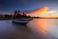 Beautiful sunset scene with fisherman boat and wooden Royalty Free Stock Photo