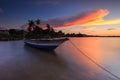 Beautiful sunset scene with fisherman boat and wooden Royalty Free Stock Photo