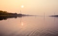 Beautiful Sunset scene On Lake water surface natural composition. Sunset over lake Royalty Free Stock Photo