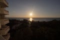 Beautiful sunset scene with sun like a star viewed from a balcony of Galeon decameron hotel room Royalty Free Stock Photo