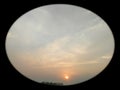 Beautiful sunset scenery view of colourful clouds with black round vignettes frame, natural canvas wallpaper