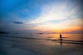 Beautiful sunset on the sea beach, swimming girls silhouette Royalty Free Stock Photo