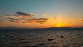 Beautiful sunset by sea. Orange sky and distant island landscape. Romantic evening seascape with sunset