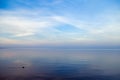 Beautiful sunset on sea, pastel colors and reflections on water, calm nature landscape with colorful clouds Royalty Free Stock Photo