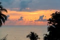 Beautiful sunset on the sea with silhouette trees. Morning sunrise on the beach of Desaru Coast, Malaysia Royalty Free Stock Photo