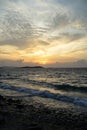 Beautiful sunset seaview on rock beach with beautiful shades of soft wide orange and blue color sky and abstract cloud background Royalty Free Stock Photo