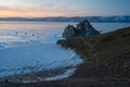 Beautiful sunset at Shaman rock, sacred stone of Olkhon island, Baikal lake, Siberia, Russia Royalty Free Stock Photo