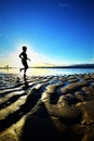 Beautiful sunset and silhouette of child at Hickam Beach, Hawaii