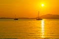 Beautiful sunset and silhouette sailing boats