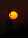 Beautiful sunset with silhouette transmission line tower. Royalty Free Stock Photo