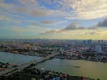 Beautiful sunset sky above the bridge of  the Chao Phraya River, Thailand. Sky blue and orange light of the sun through the clouds Royalty Free Stock Photo