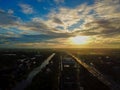 Beautiful sunset sky above the city with sky blue and orange light of the sun through the clouds in the sky  Orange and red Royalty Free Stock Photo