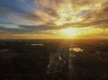 Beautiful sunset sky above the city with sky blue and orange light of the sun through the clouds in the sky  Orange and red Royalty Free Stock Photo