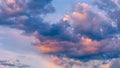 Beautiful sunset sky above clouds with dramatic light. Sunset sky for background, sunrise sky and clouds. Bright orange and blue Royalty Free Stock Photo