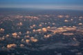 Beautiful sunset sky above clouds with dramatic light. Cabin view from airplane Royalty Free Stock Photo