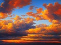 Beautiful sunset sky above clouds with dramatic light. Yellow, orange, red clouds above the horizon. Beautiful evening Royalty Free Stock Photo