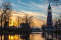 A beautiful sunset sky behind the lighthouse located in dutch city of Breda