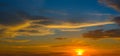 Beautiful Sunset in the sky with sky blue and orange light of the sun through the clouds in the sky, Orange and red dramatic Royalty Free Stock Photo