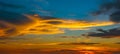 Beautiful Sunset in the sky with sky blue and orange light of the sun through the clouds in the sky, Orange and red dramatic Royalty Free Stock Photo