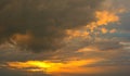 Beautiful Sunset in the sky with sky blue and orange light of the sun through the dark clouds in the sky, Orange and red dramatic Royalty Free Stock Photo