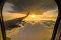 Beautiful sunset sky clouds seeing through the airplane window Royalty Free Stock Photo